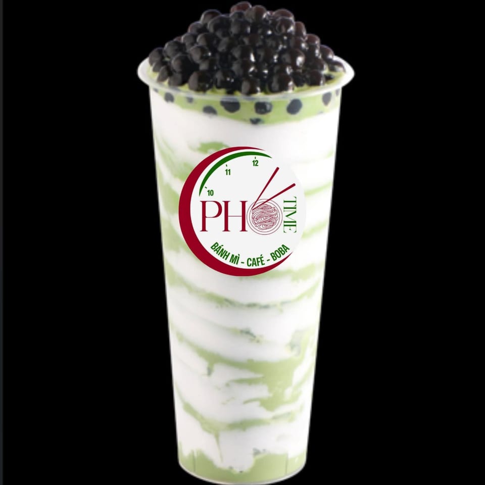 Pho Time's green and white swirled boba drink, topped with dark boba pearls.
